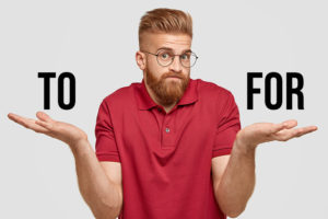 I know nothing. Handsome stylish hipster with thick ginger beard, spreads palms with questionned expression, being unsure, wears transparent glasses, poses against white background. Doubt concept