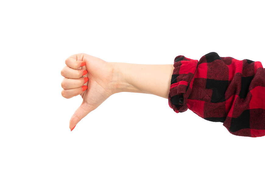 a front view female hand in black-red checkered shirt showing no